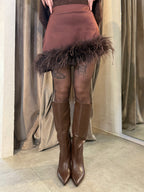 Minigonna asimmetrica con piume